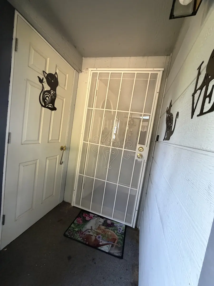 Security screen door and entry door viewed from the hallway