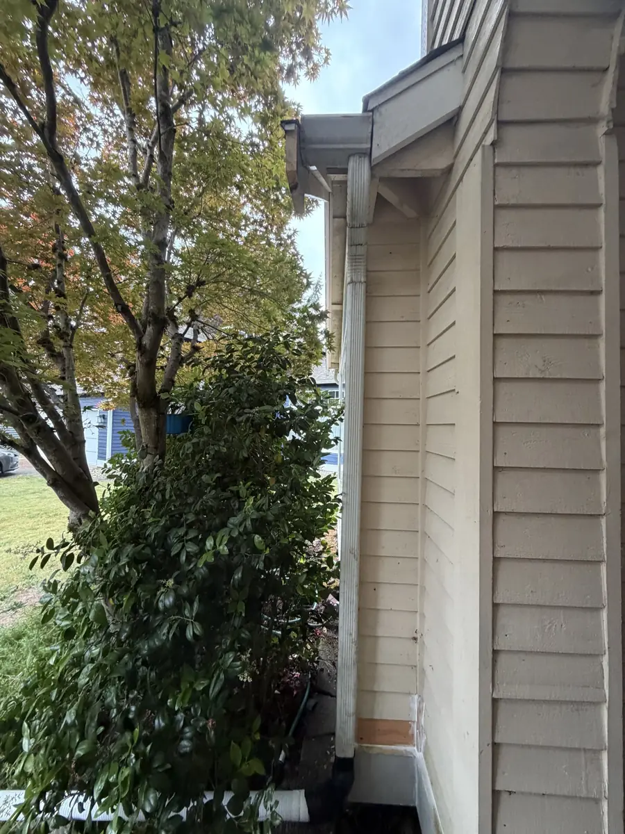 Exterior corner trim and eave of a house, wider view